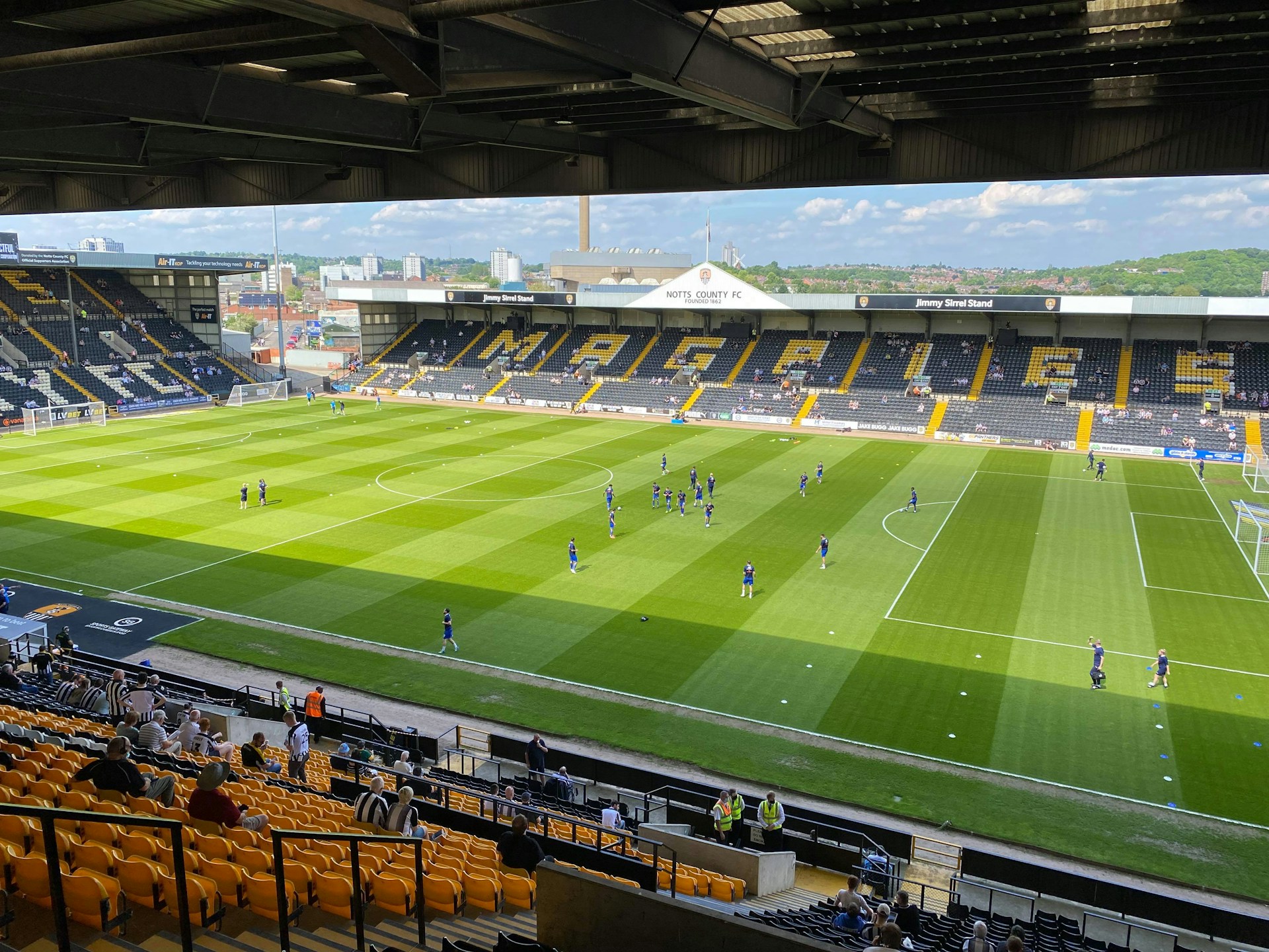 woman wearing yellow long-sleeved dress under white clouds and blue sky during daytime